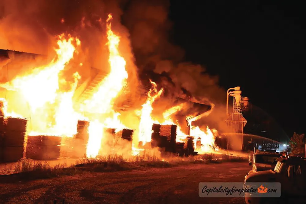 FIRE STRIKES WEABER ON EYE OF LAYOFFS